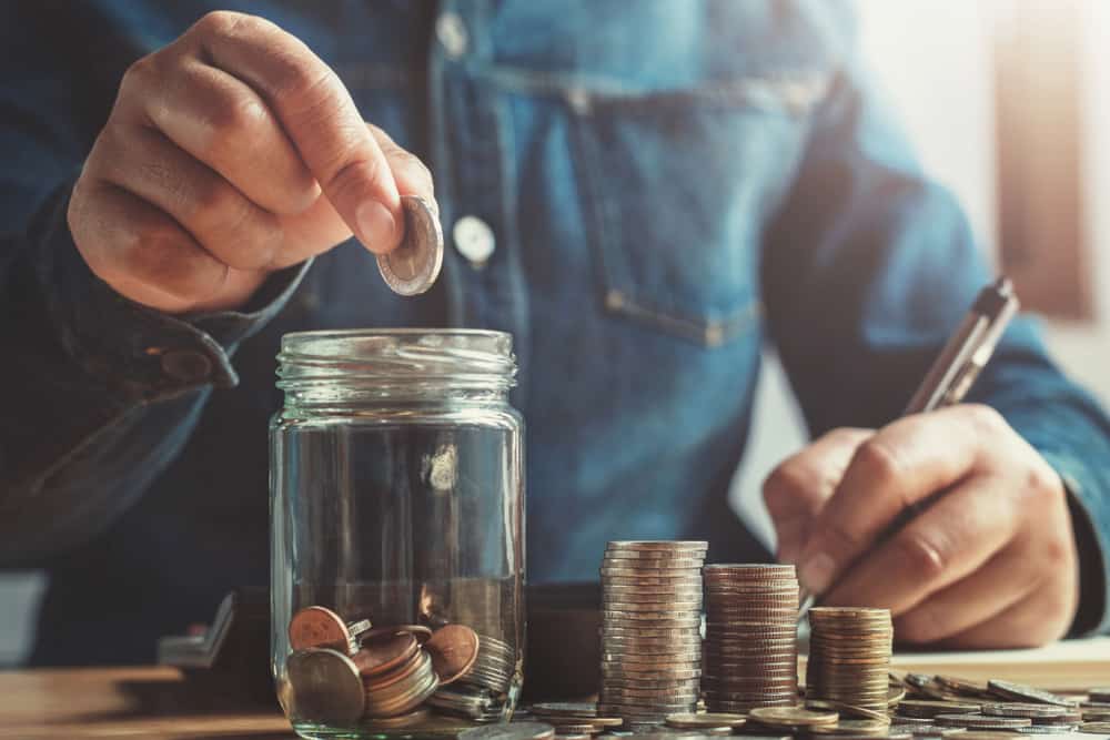 Counting the spare change in a savings jar