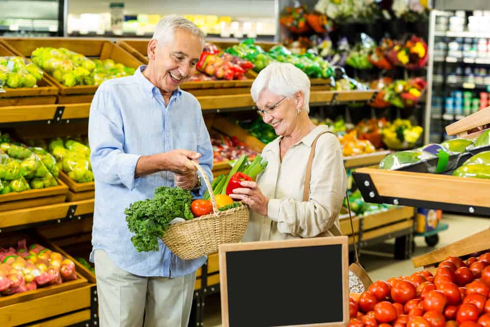 Senior couple buying groceries